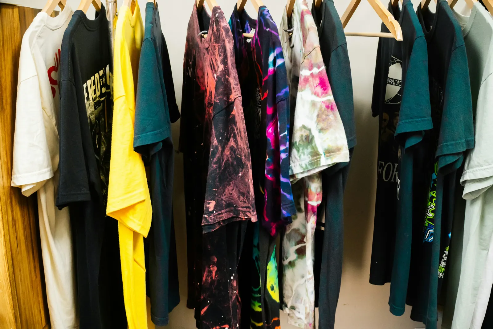 Printed graphic t-shirts hanging on a clothing rack